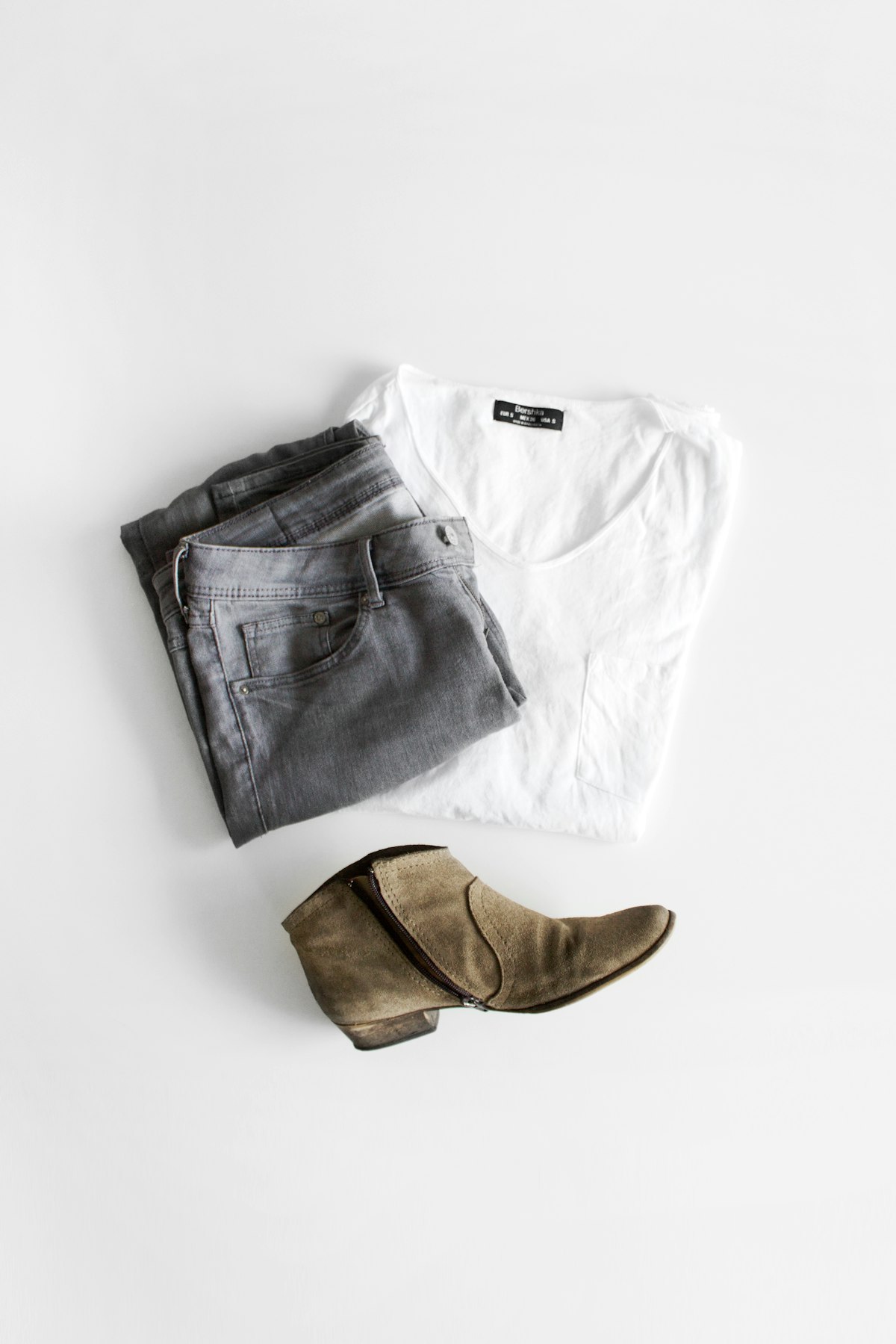 Minimal clothing rack representing WoozKa Brands apparel line